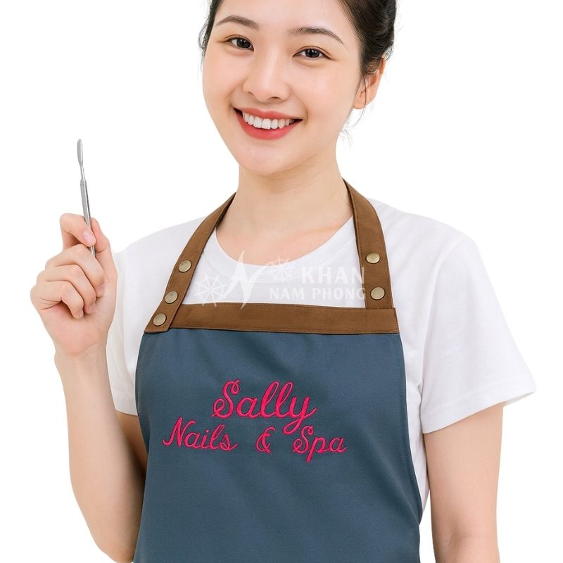 Tạp Dề Nails & Spa Màu Xanh Đen Phối Nâu Cotton Lạnh Cổ Vuông Freesize Thêu Logo Sally