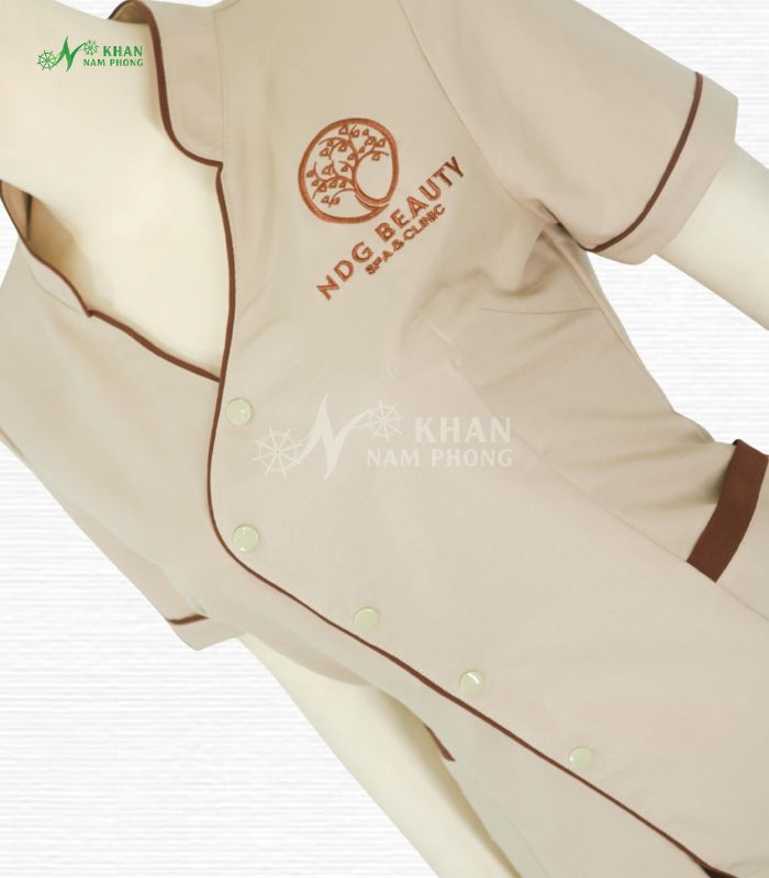 Đồng phục massage cotton lạnh lệch tàu be nâu thêu logo theo yêu cầu tại Gò Vấp