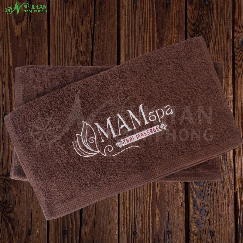 Khăn lau mặt spa cotton 30x50cm màu nâu socola thêu logo MAM spa chỉ trắng