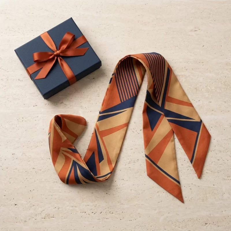 Khăn twilly lụa họa tiết kỷ hà geometric cam đất phối navy quấn quai túi xách cao cấp