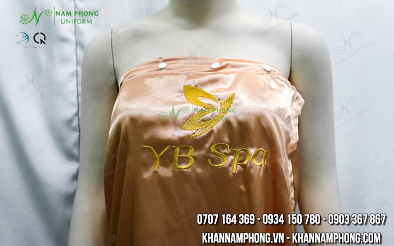 Váy (Áo) Quây Màu Cam Lụa Phi Bóng Thêu Logo &Quot;Yb Spa&Quot; Váy (Áo) Quây Màu Cam Lụa Phi Bóng Thêu Logo "YB Spa"
