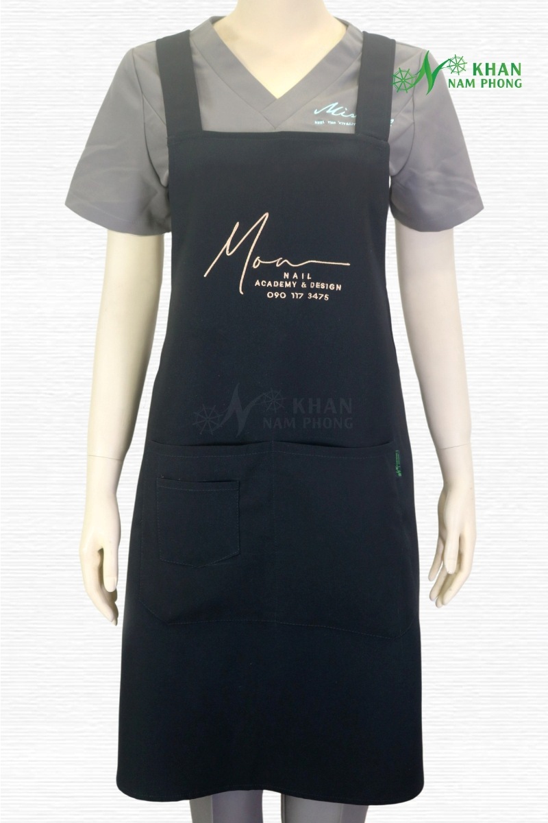 Tạp Dề Nail Màu Đen Cotton Lạnh Thêu Logo Moa Nail Academy Freesize Tạp dề nail màu đen cotton lạnh thêu logo Moa Nail Academy freesize